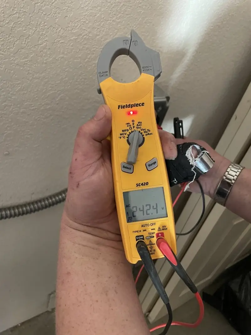 Voltage testing with clamp meter during Generator Installation in Isanti